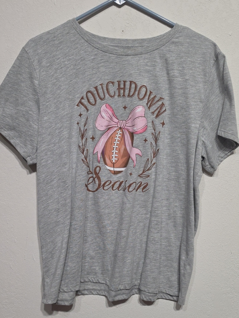 Hobby Lobby Gray Short Sleeve Tee with Pink Football Bow Graphic